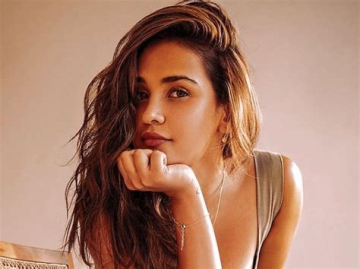 Aisha Sharma in Bathing Suit is "Tanning" — Celebwell